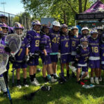 A lacrosse team with purple jerserys